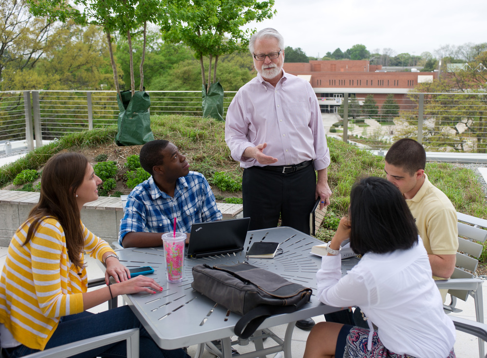 Faculty talking to students